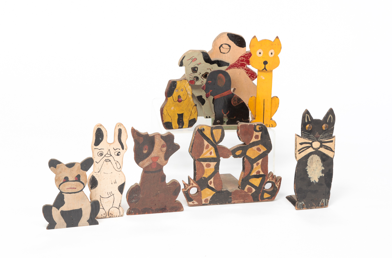 NINE AMERICAN FOLKSY ANIMAL DOOR STOPS.