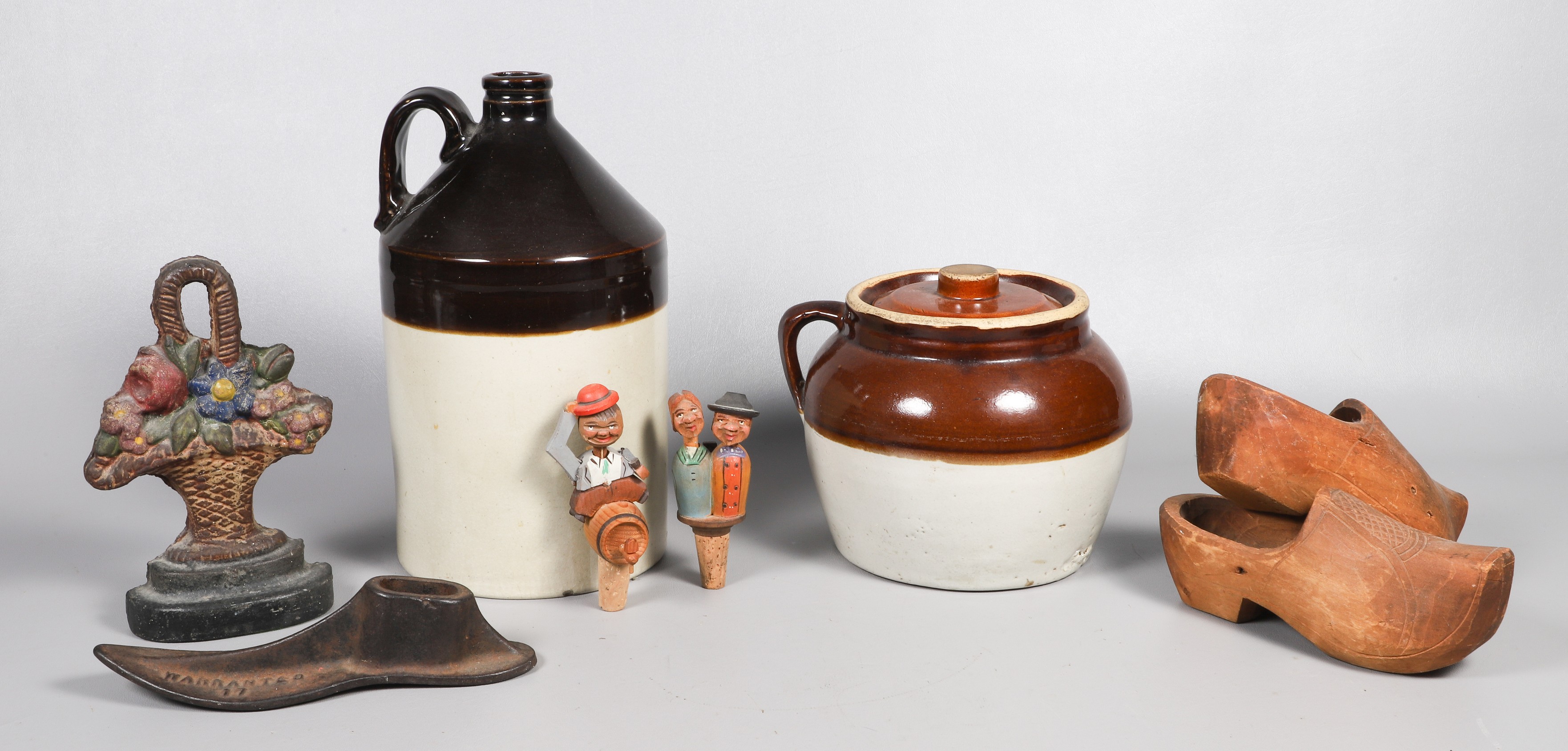 Pottery jugs, cast iron, carved wood