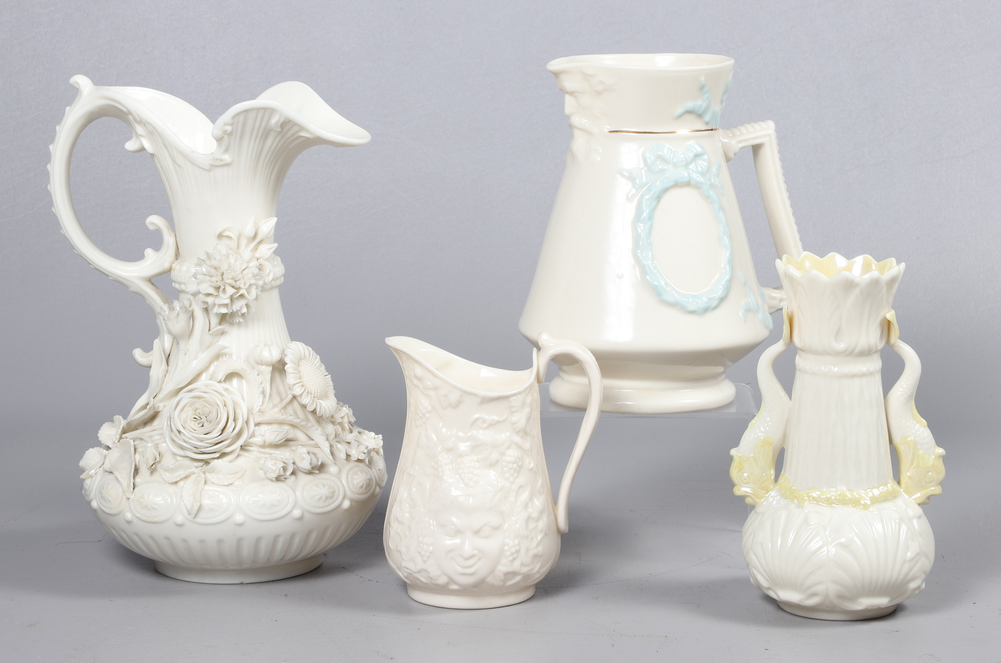 (4) Belleek pitchers and vase to