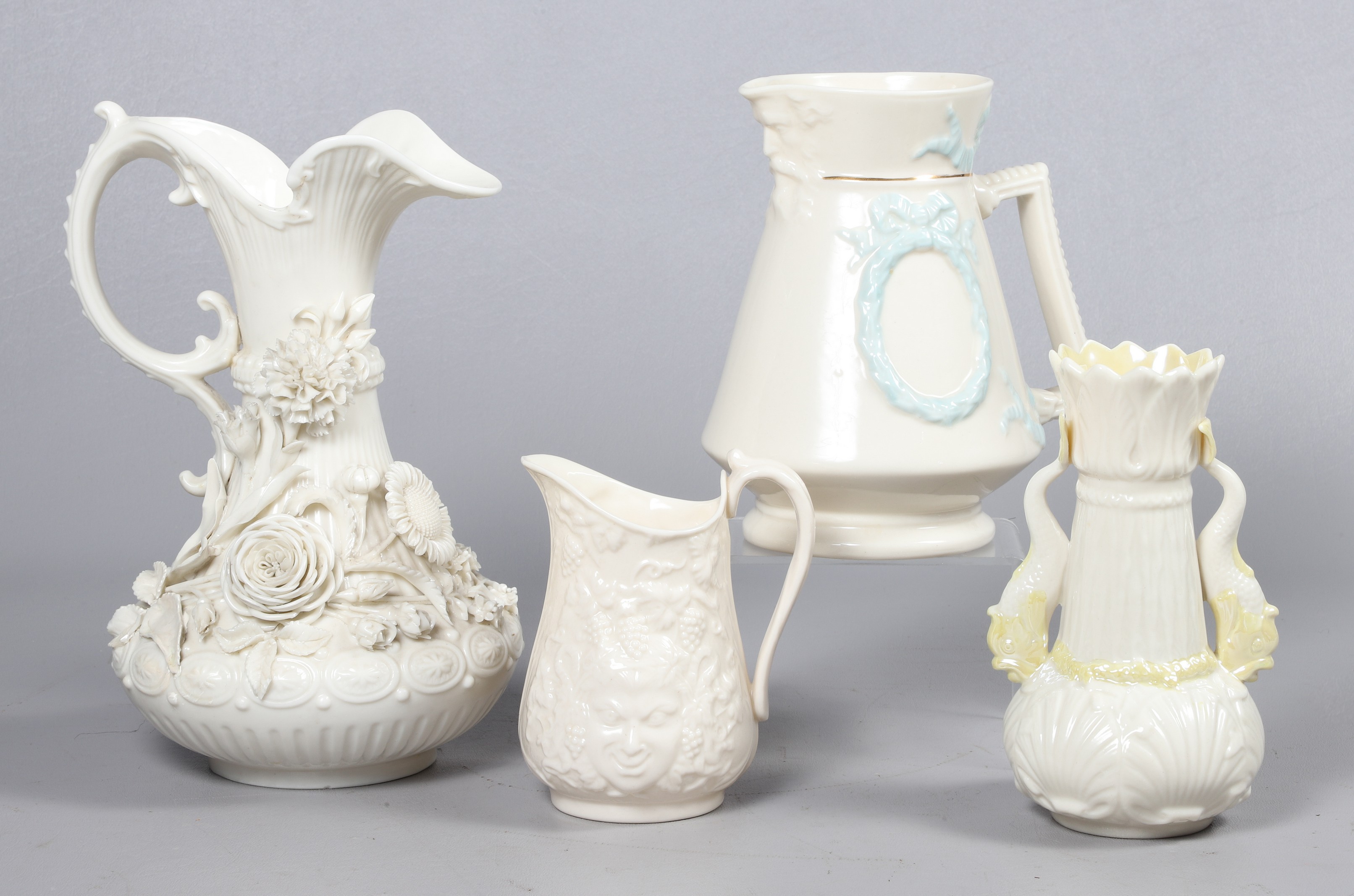 (4) Belleek pitchers and vase to include