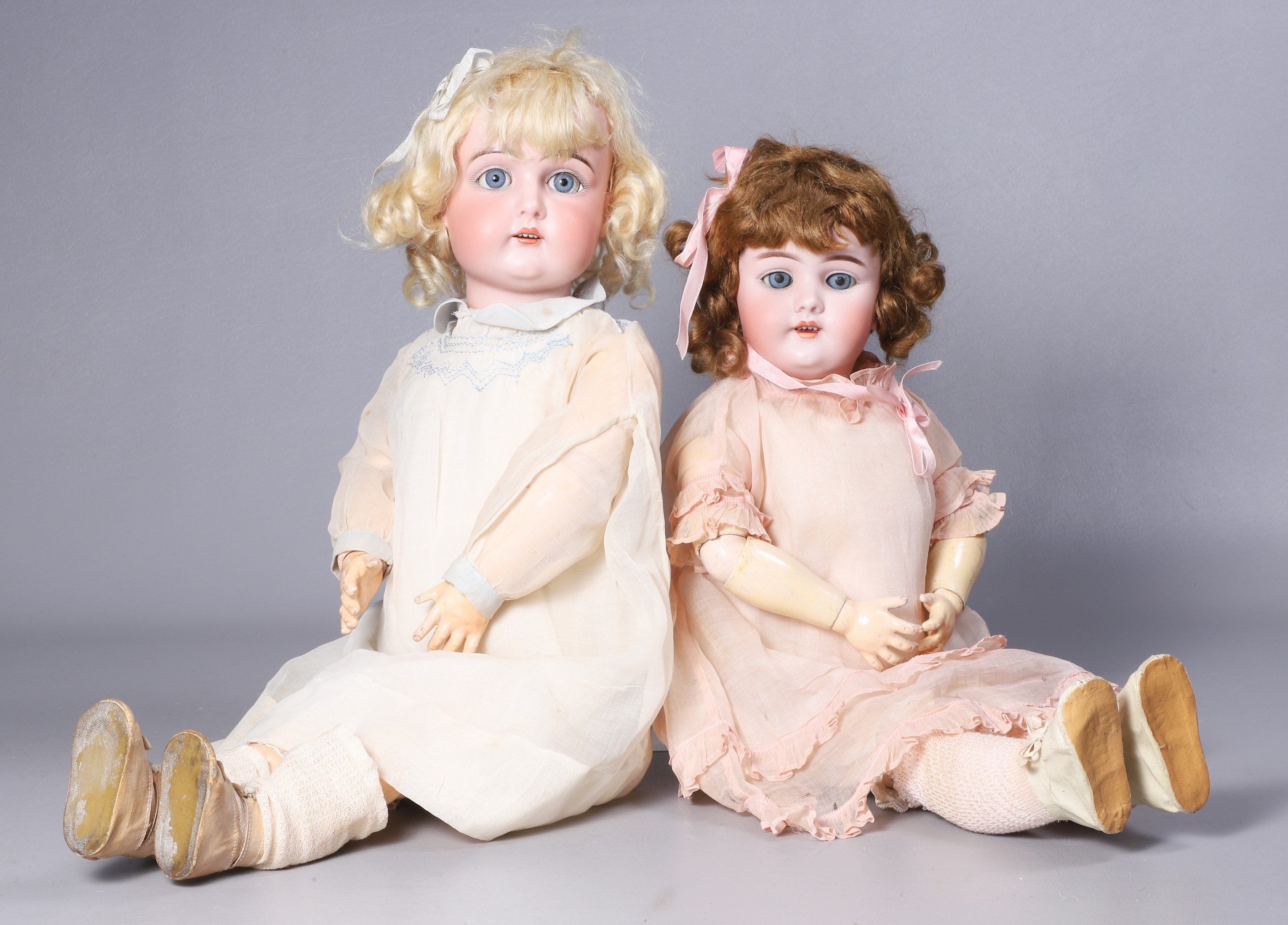 (2) Porcelain dolls, sleep eyes, open