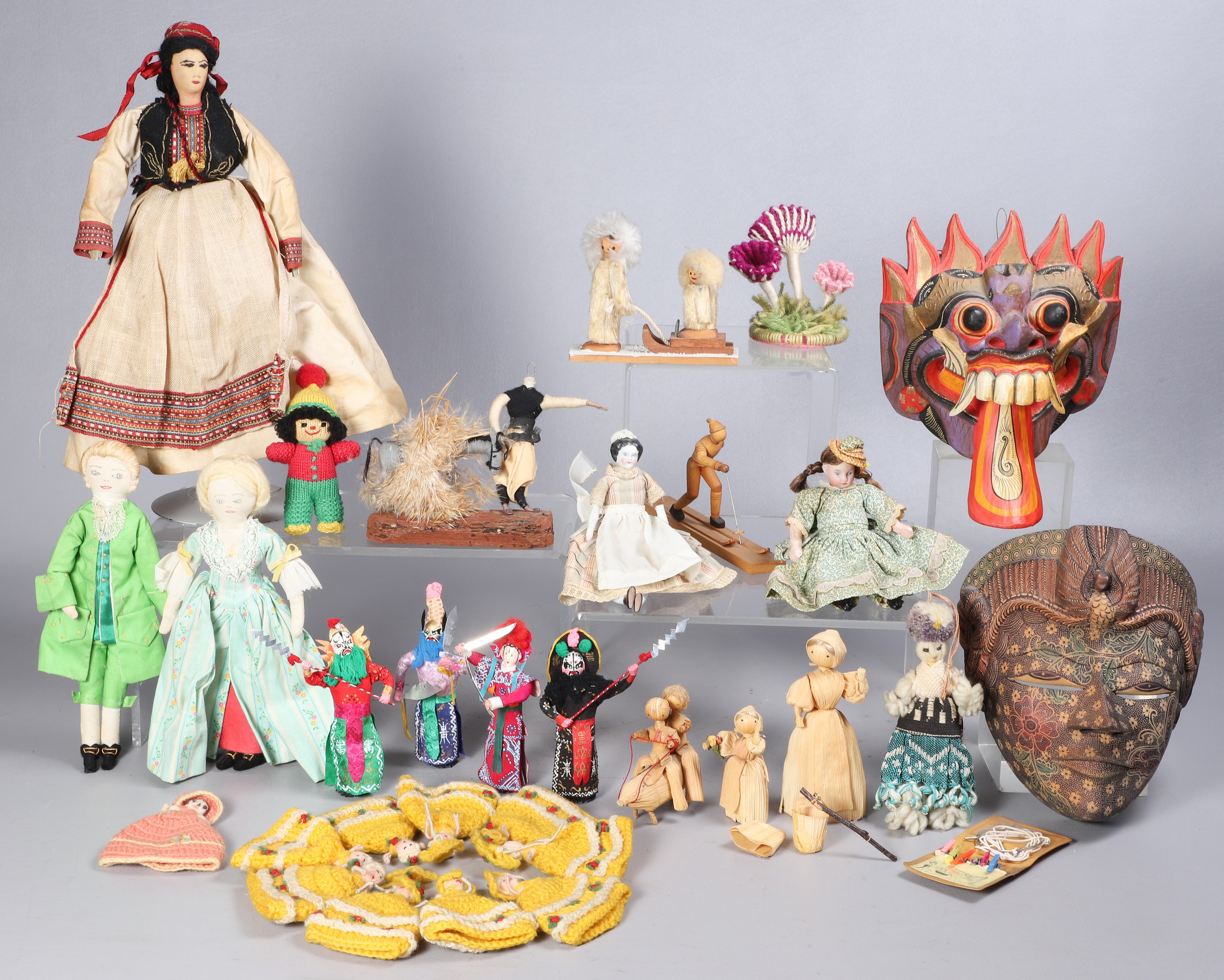 Assorted dolls, ethnic masks to
