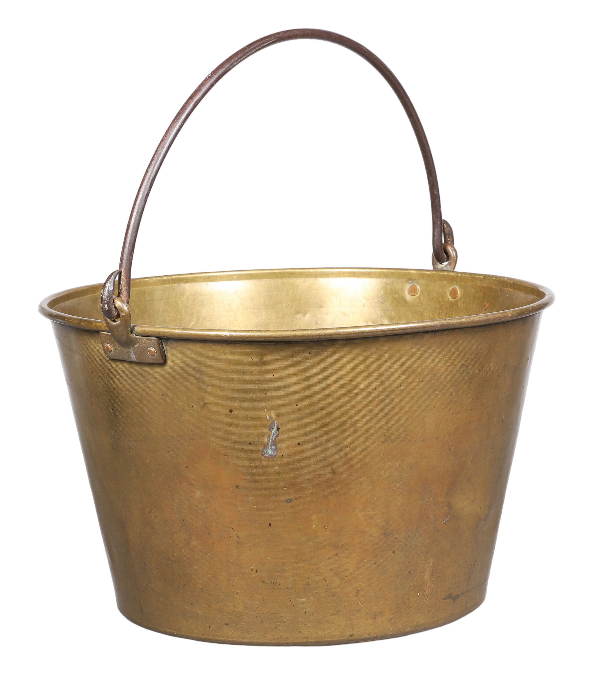 A very large brass kettle with