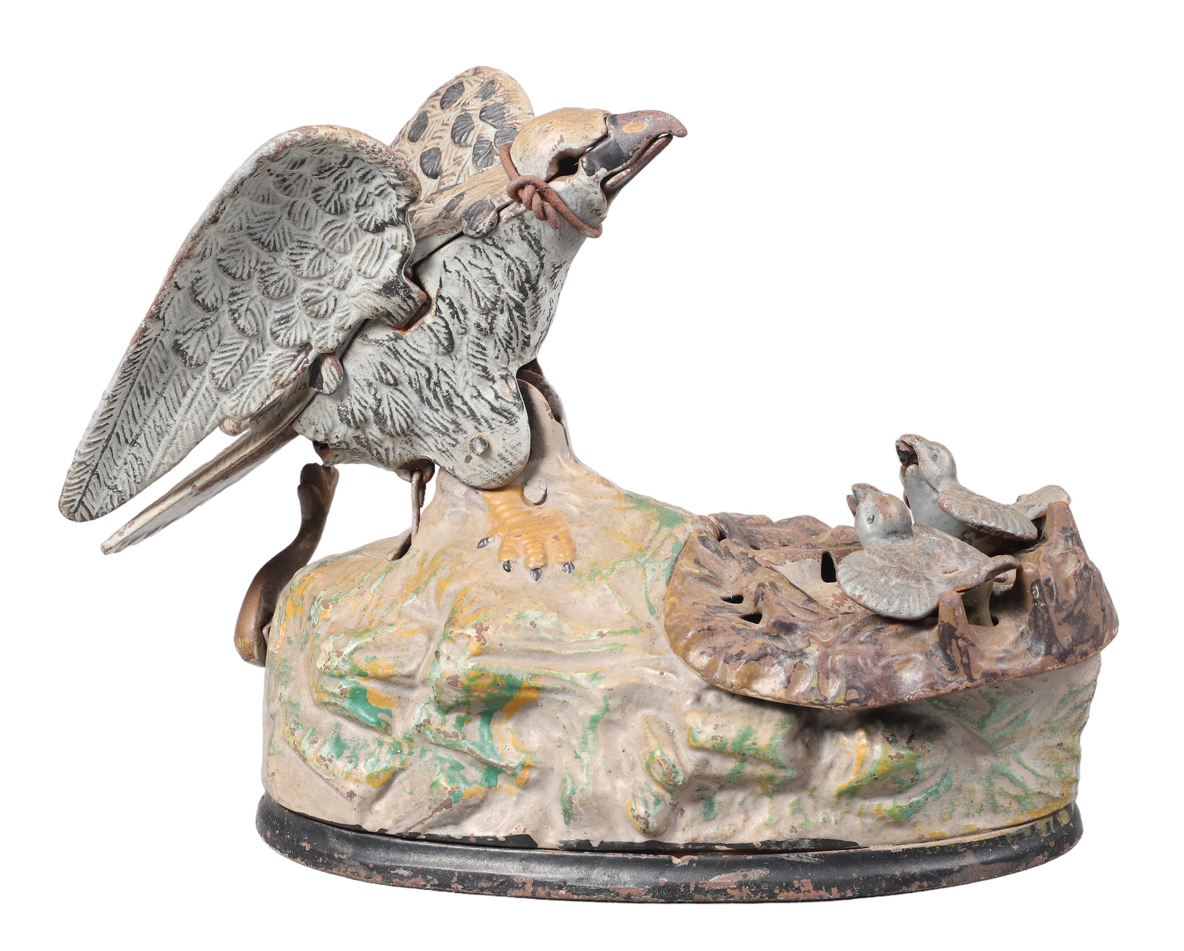 A mechanical bank with a mother bird