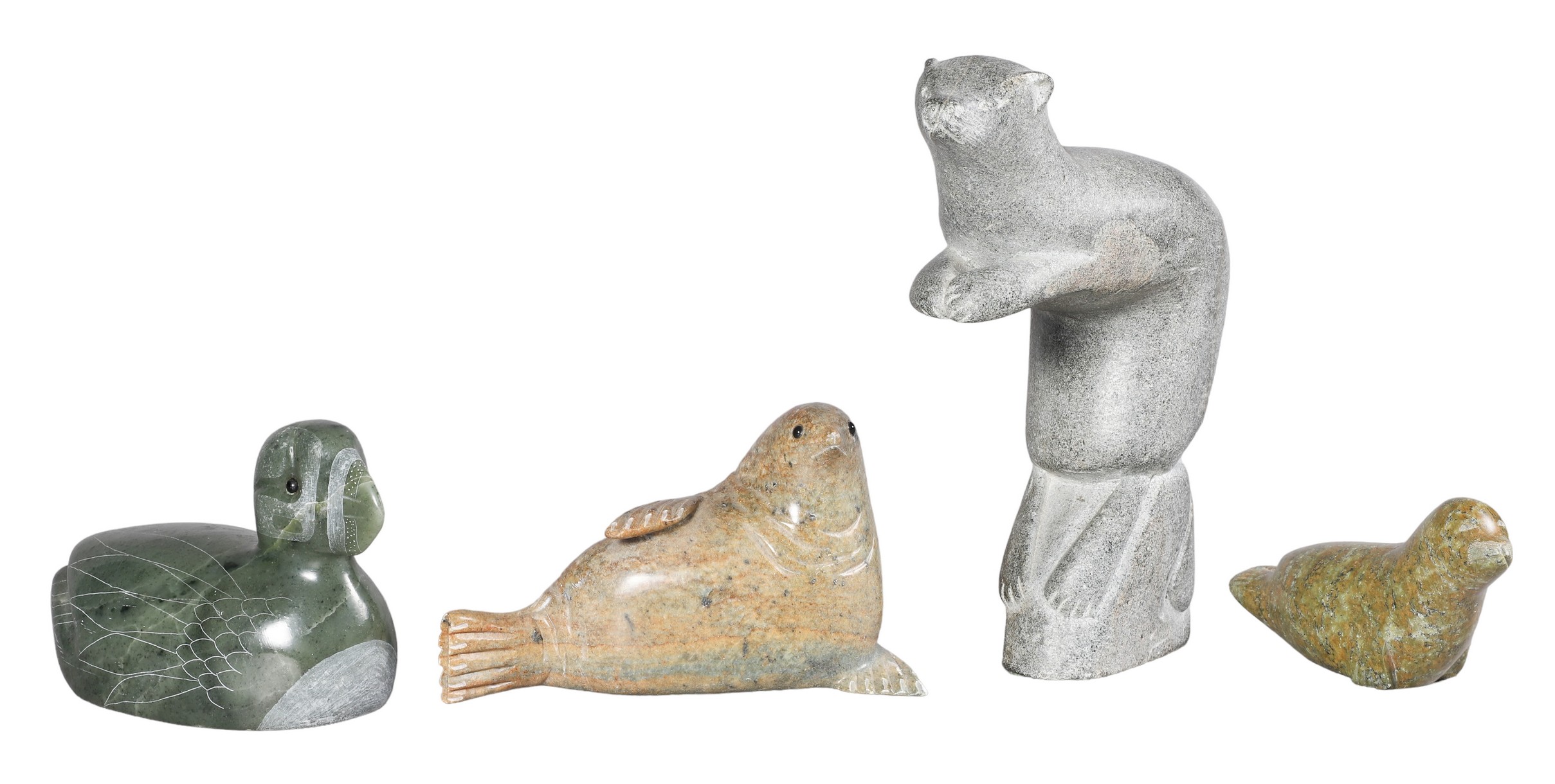 (4) Inuit carved stone sculptures,