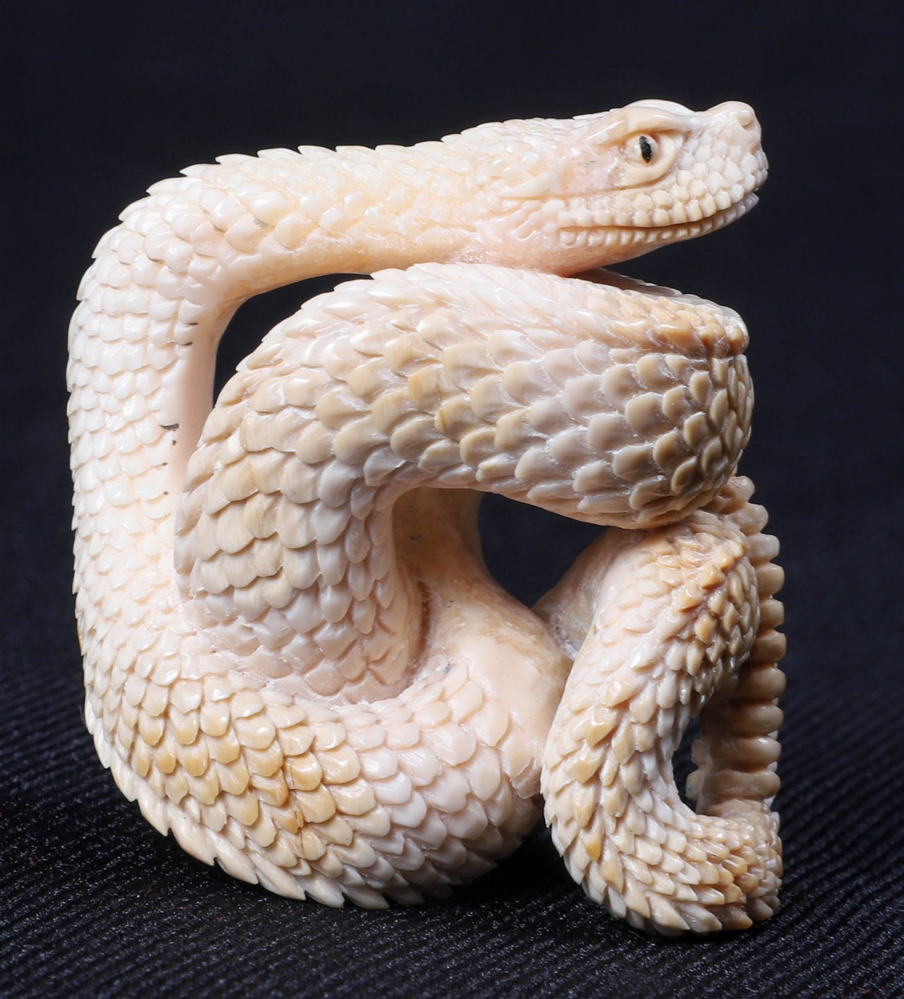 A Carved Ivory Snake Netsuke, hairlines