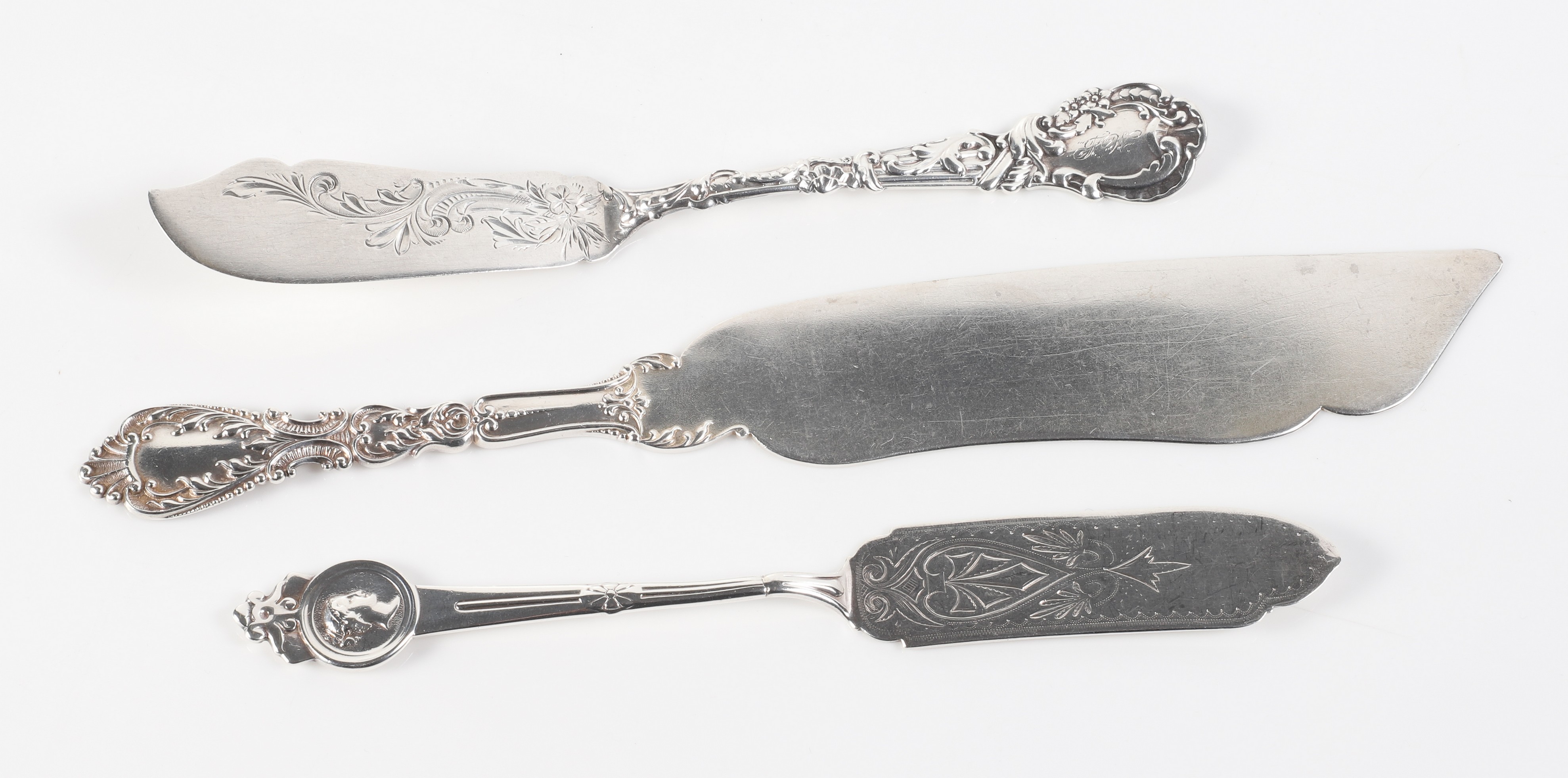 (3) Sterling silver serving knives,
