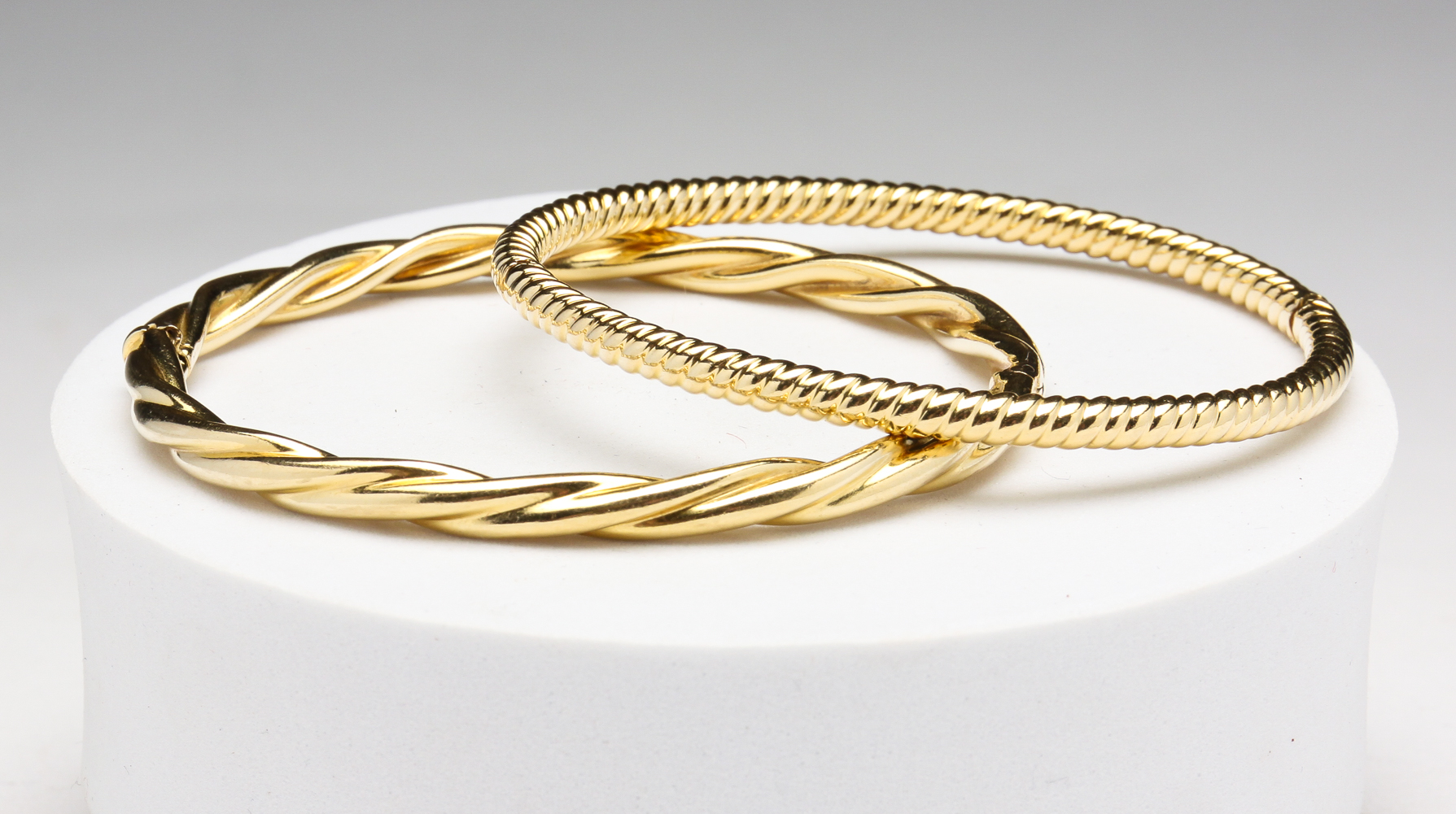 TWO 18 KARAT TWISTED GOLD BANGLE 2df916