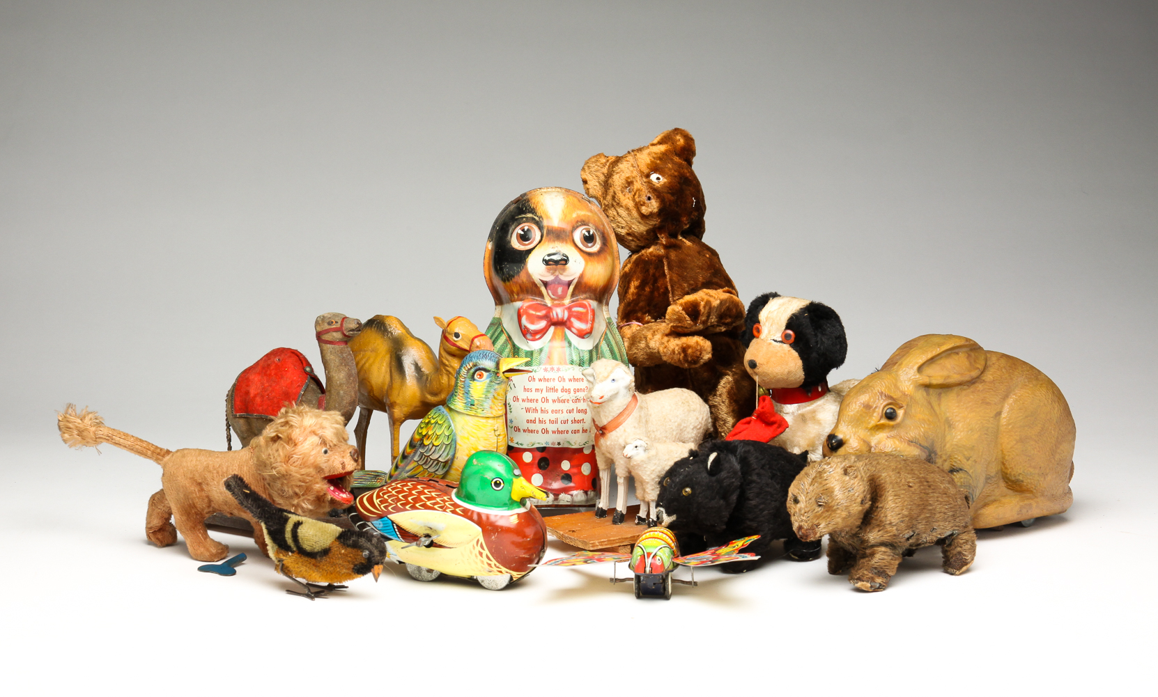 GROUP OF WIND-UP AND WHEEL TOYS.