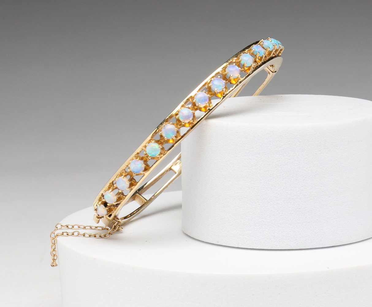 VINTAGE 14K AND OPAL BANGLE BRACELET.