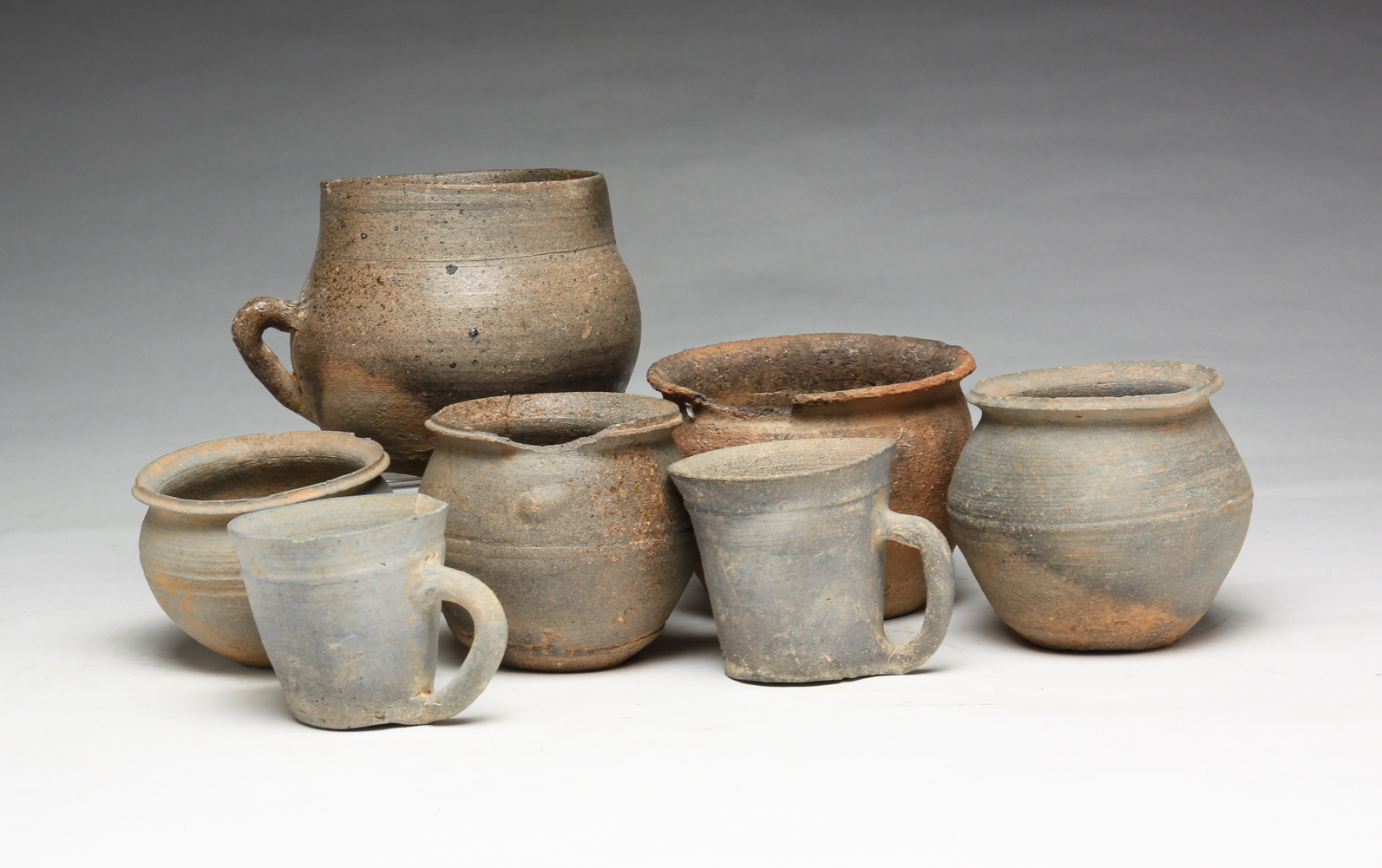 SEVEN KOREAN SILLA POTTERY CUPS