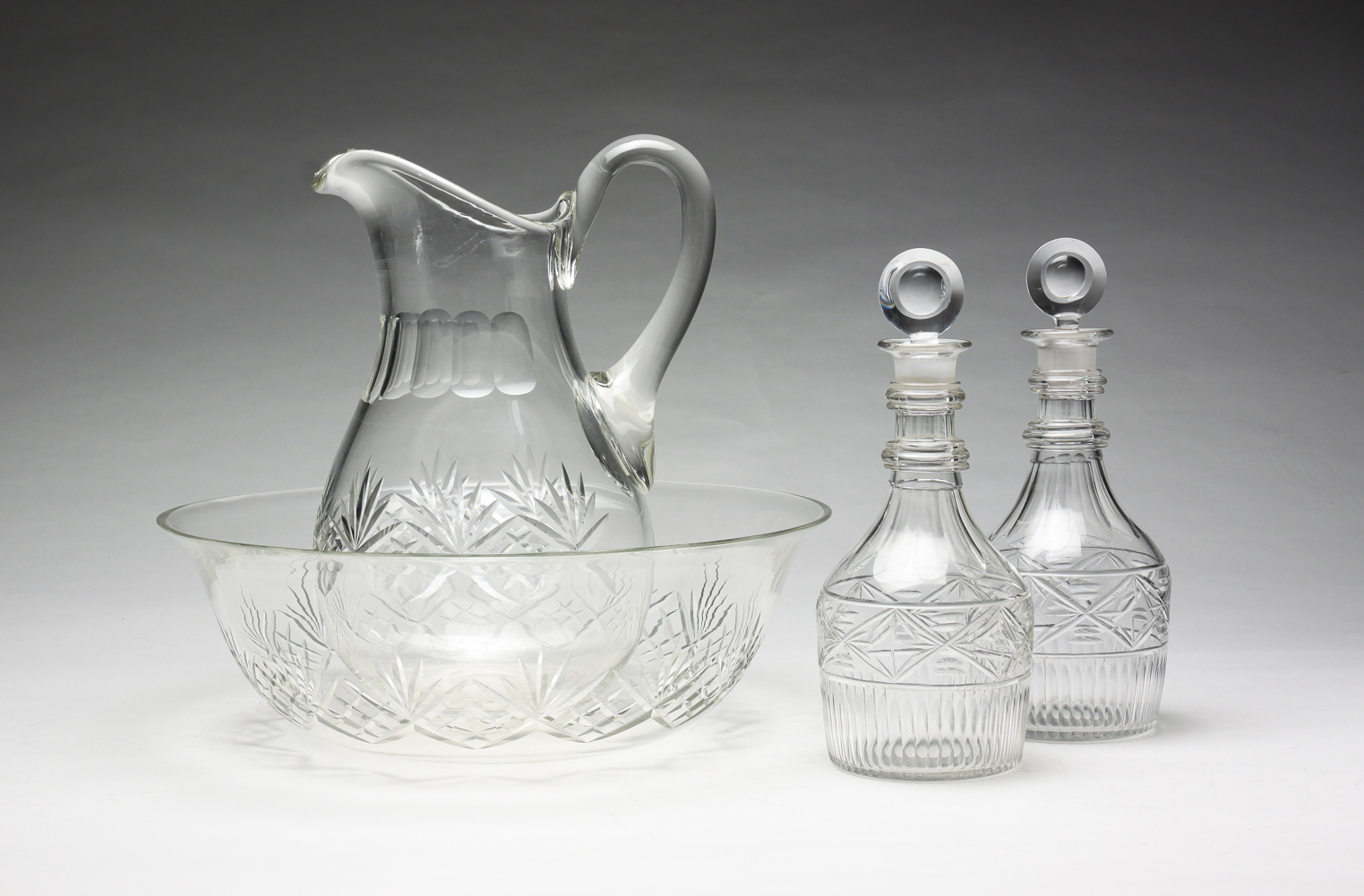 FOUR PIECES OF ENGLISH CUT GLASS.