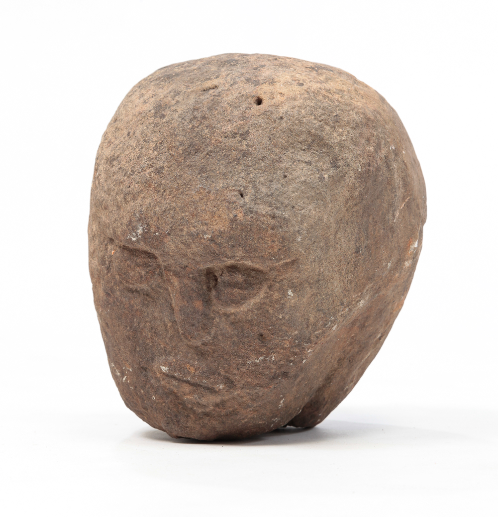 AMERICAN FOLK ART CARVED STONE HEAD.