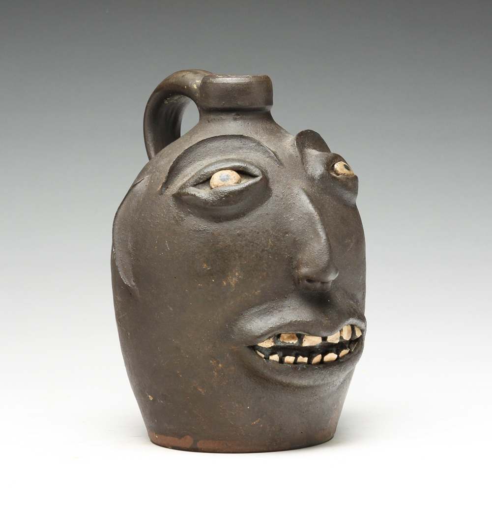 AMERICAN GROTESQUE FACE JUG. First half-20th