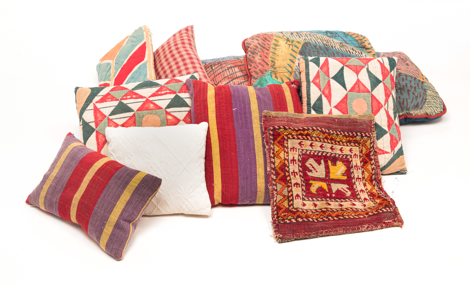 GROUP OF CONTEMPORARY FOLKSY PILLOWS.