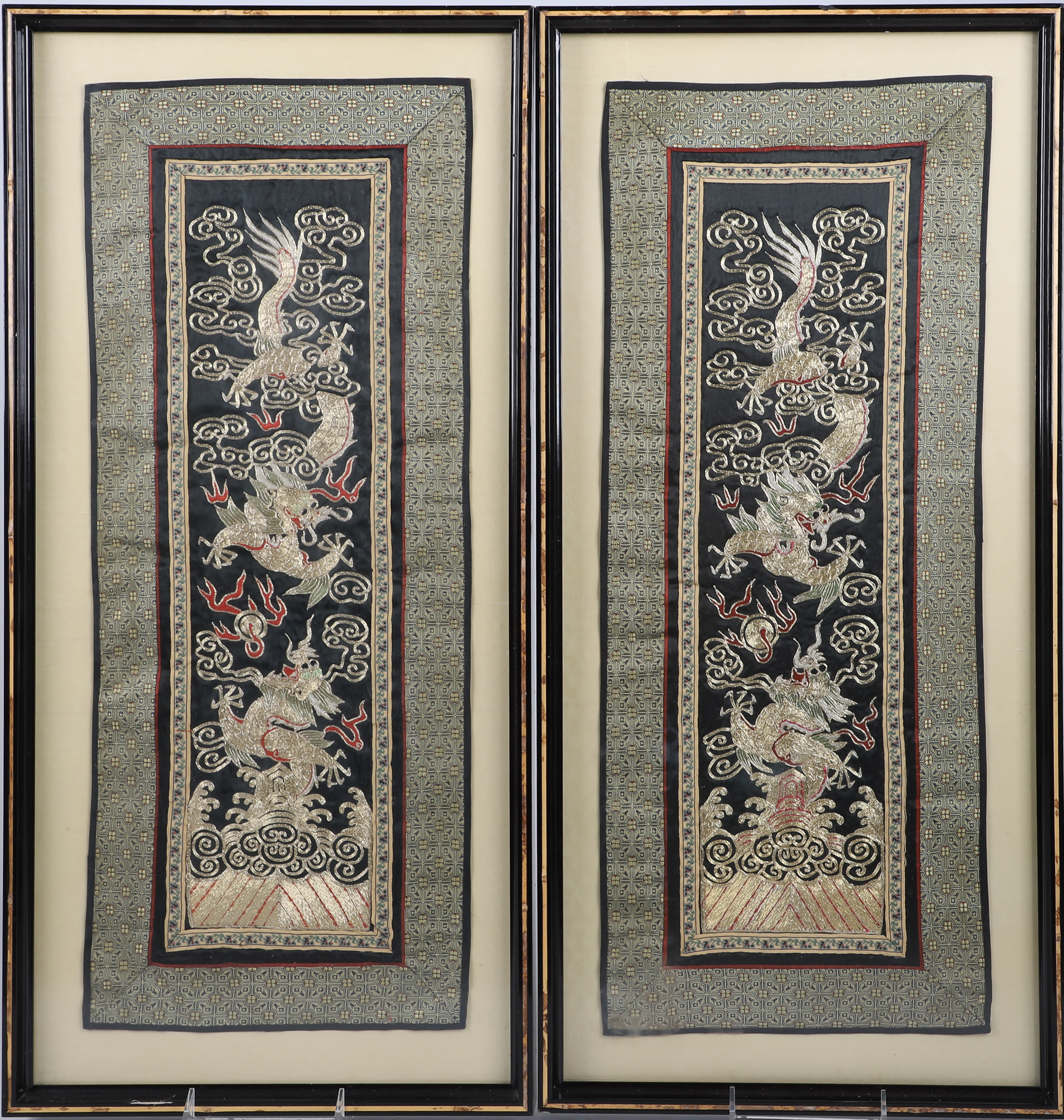 Pair of Chinese embroideries, gold dragons,