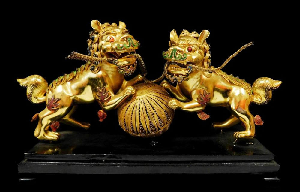 ASIAN: TWO GILDED METAL FOO DOGS