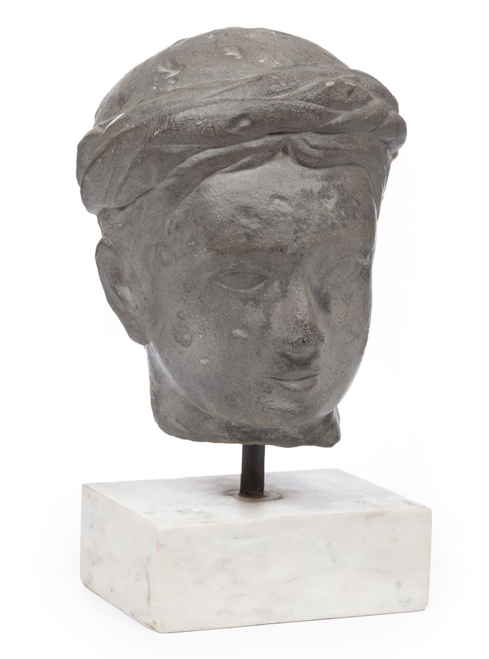 CARVED STONE HEAD OF A TURBANNED