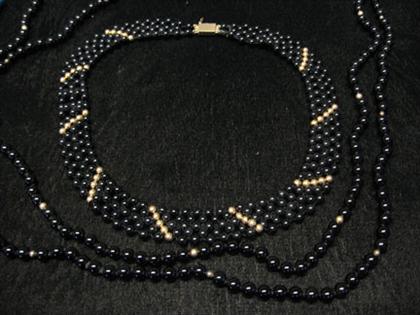 Two black onyx bead necklaces,