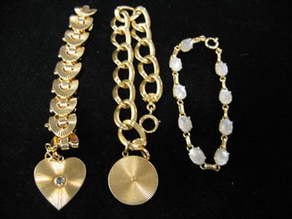 Three gold bracelets    Two with