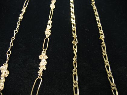 Two 14 karat yellow gold neck chains