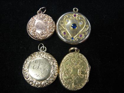 Four circular lockets    One with coat