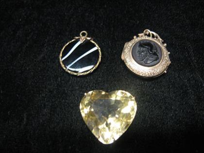 Three gold necklace charms    Locket