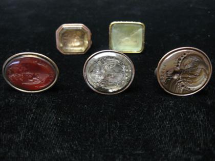 Six rolled yellow gold and intaglio