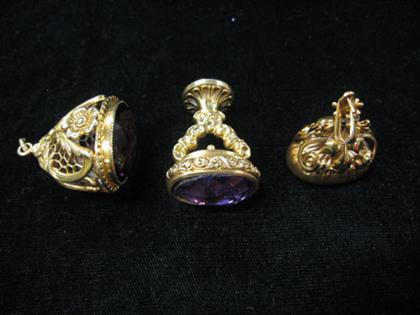 Three amethyst 14 karat yellow