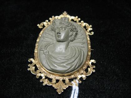 Lava cameo pin of a classical sinistral