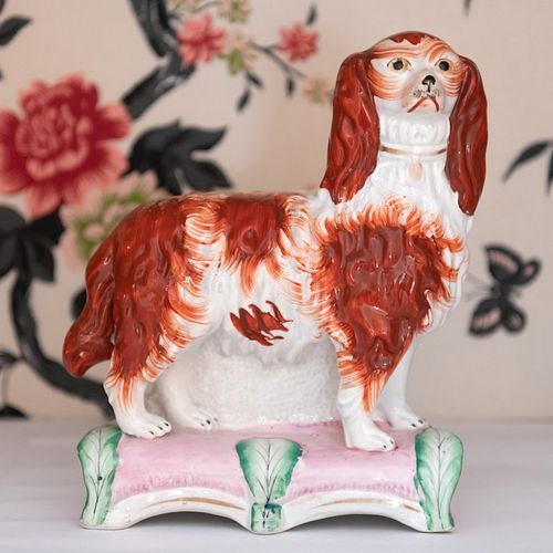 PAIR OF STAFFORDSHIRE DOGS ON PLINTHS