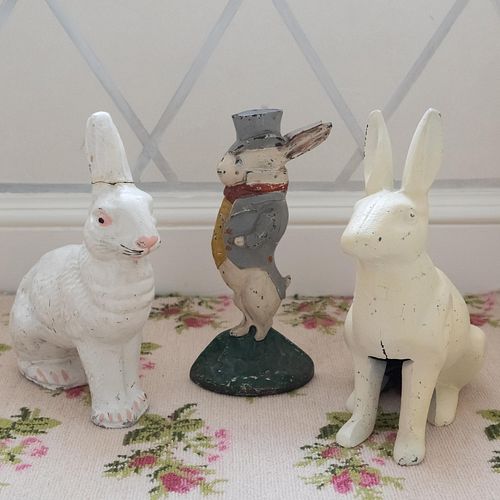 GROUP OF THREE PAINTED IRON RABBIT