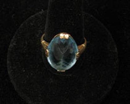 Blue topaz and yellow gold ring