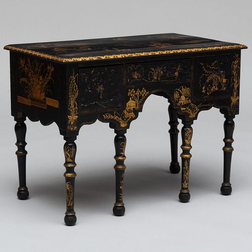 CONTINENTAL BLACK PAINTED AND PARCEL-GILT