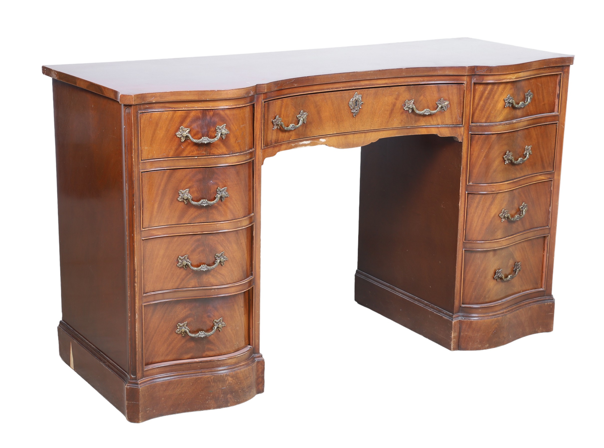 Mahogany serpentine desk, center drawer