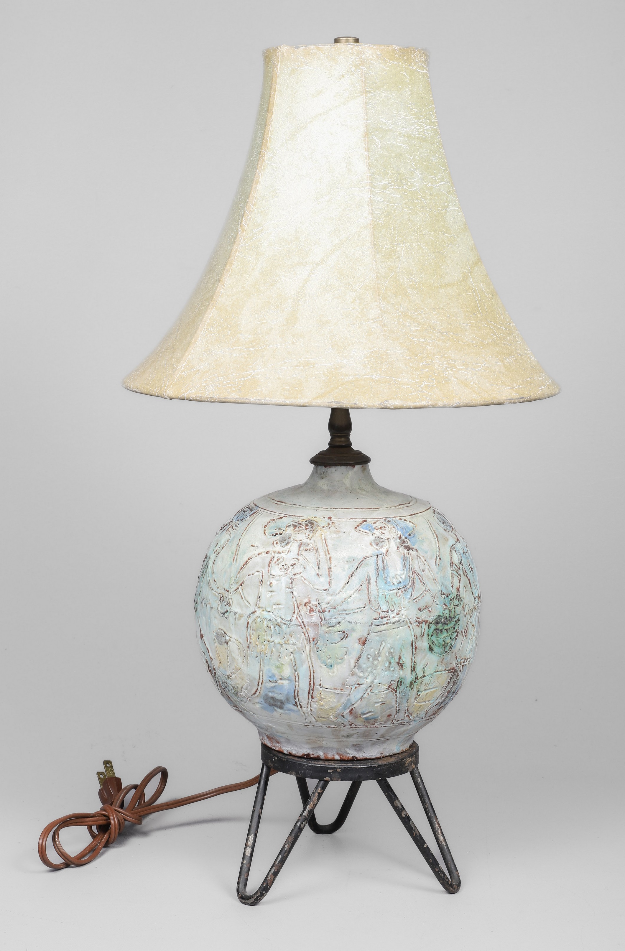 Art pottery table lamp, incised figural