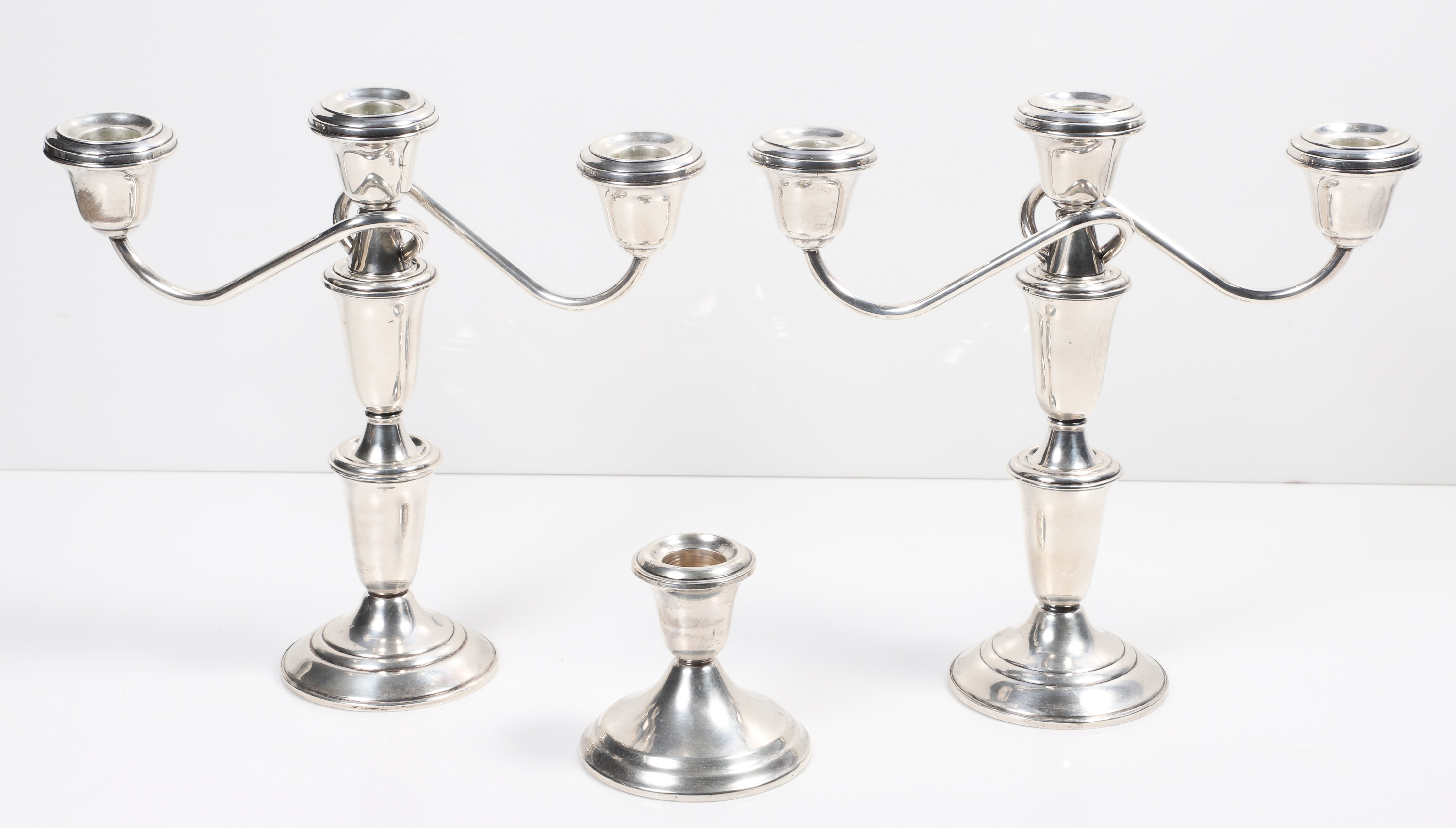 (3) Weighted sterling silver candlesticks,