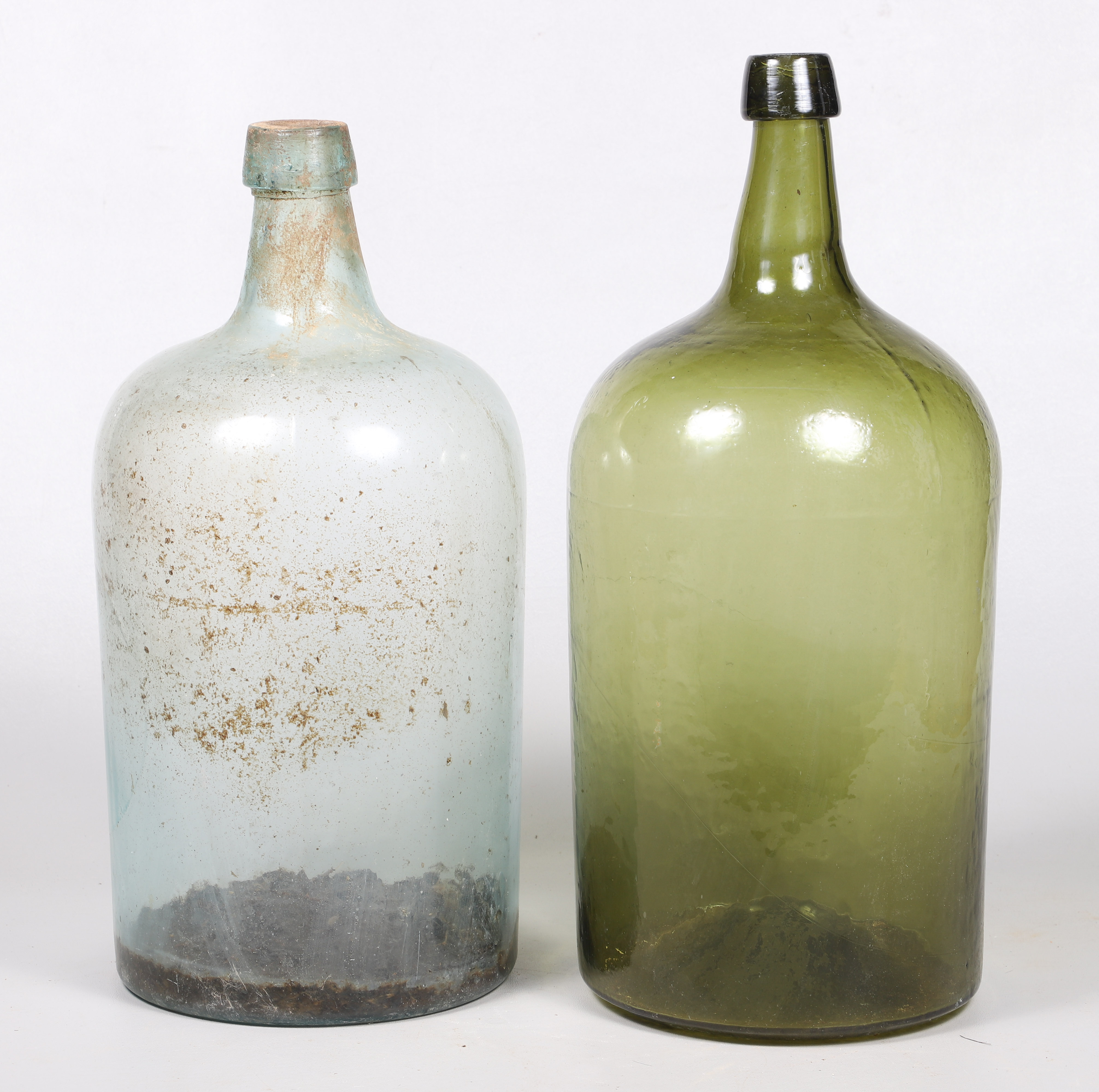 (2) Blown glass bottles, in aqua and