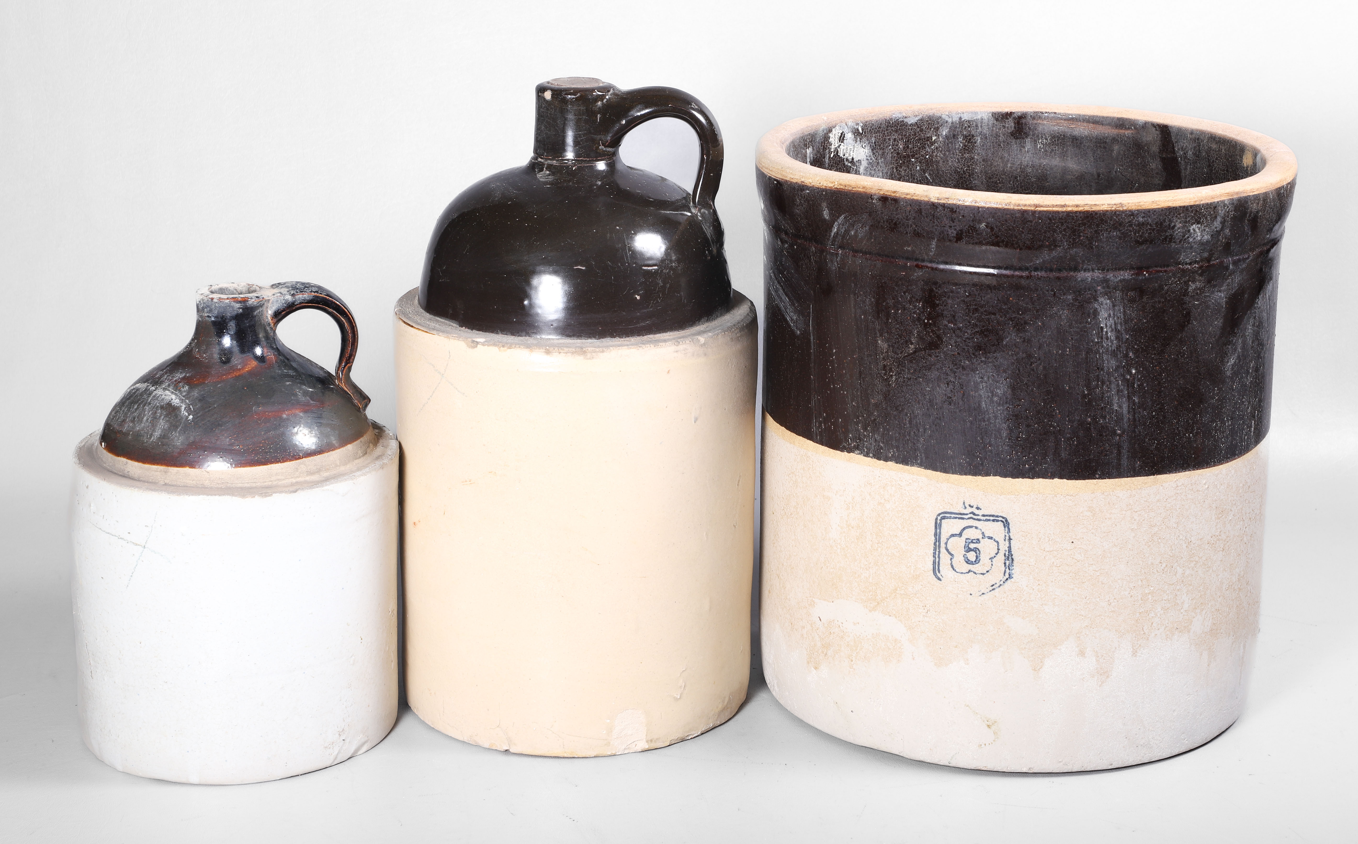 (3) Stoneware pottery jugs and crock