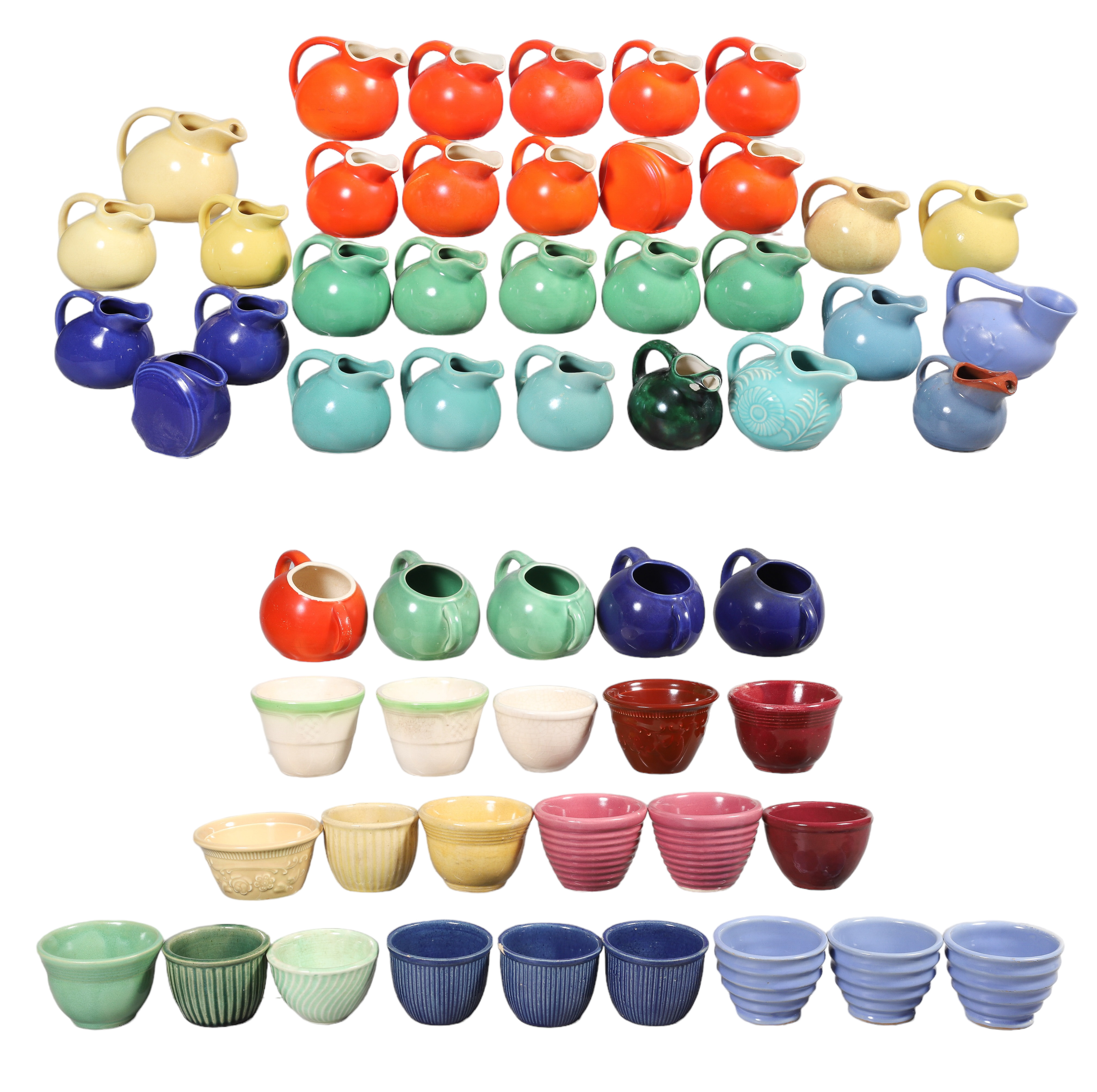 A Large group of pottery creamers