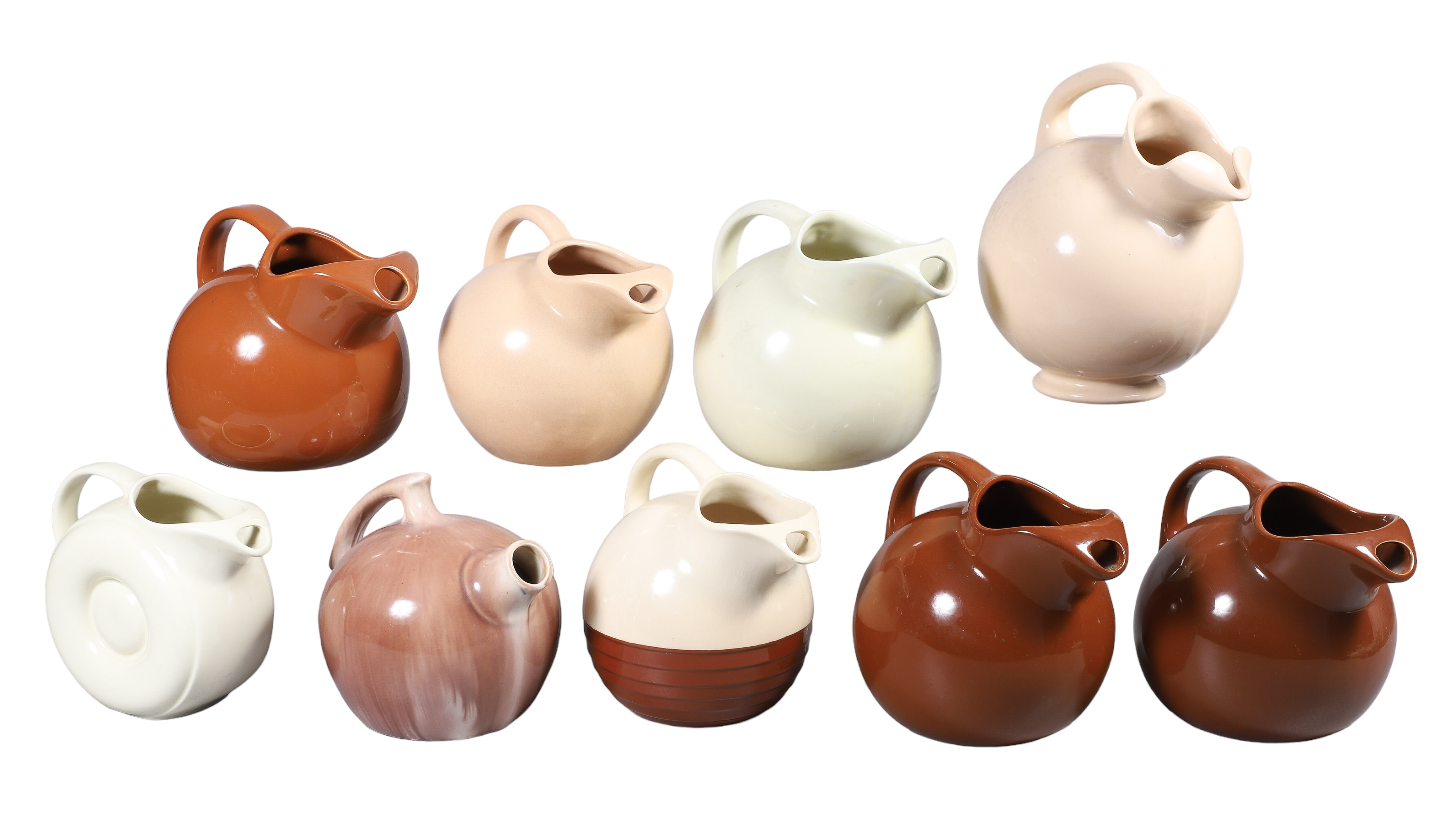 (9) Brown and cream pottery pitchers,