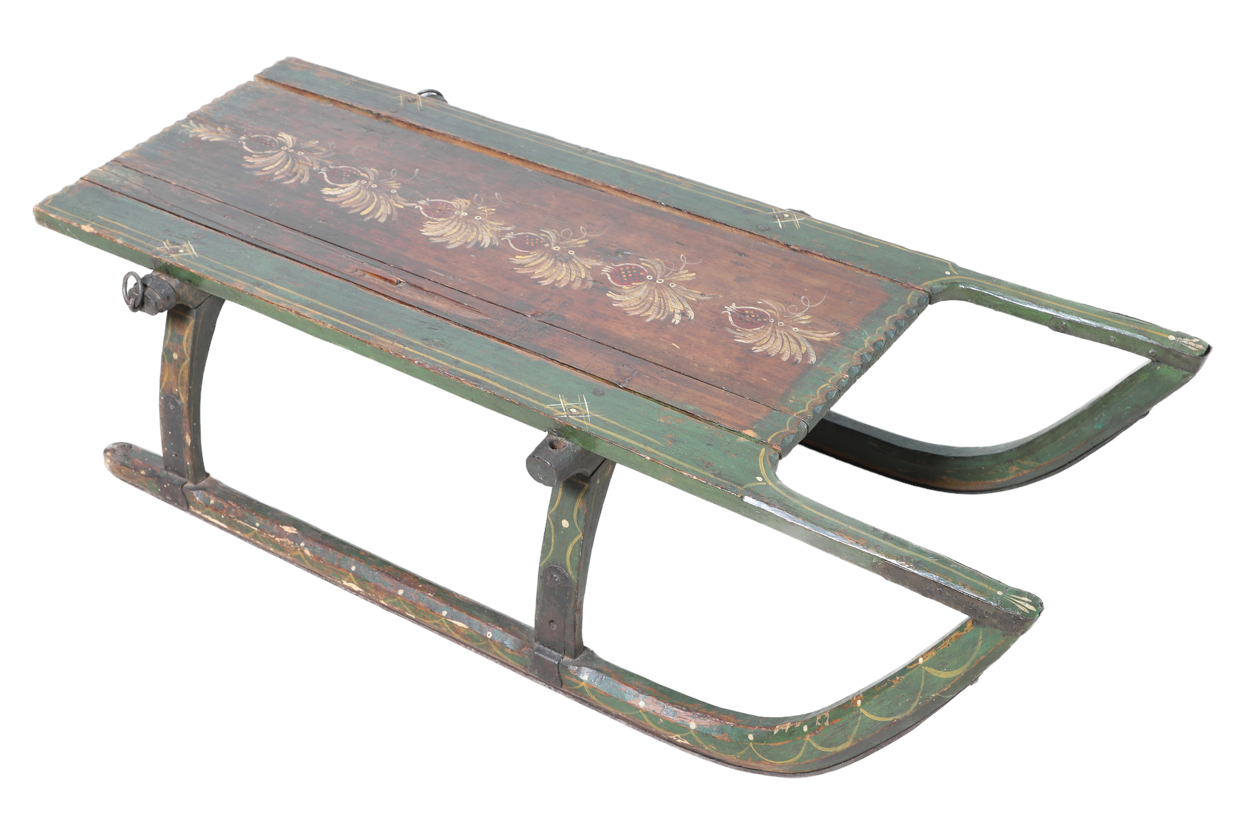 Green painted sled, wrought iron