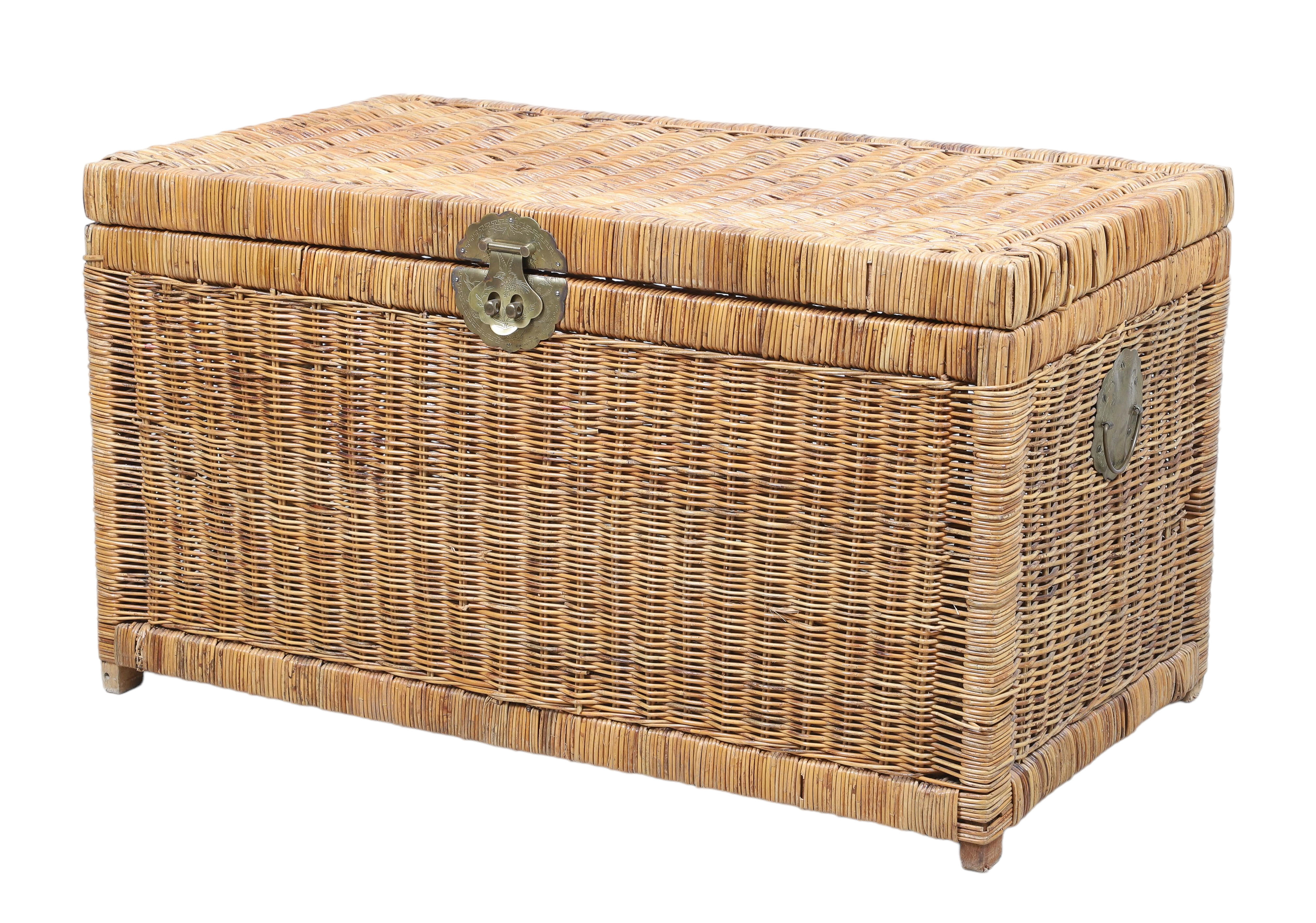 A large wicker and brass trunk,
