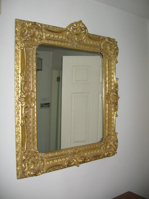 Molded gilt decorated mirror    The