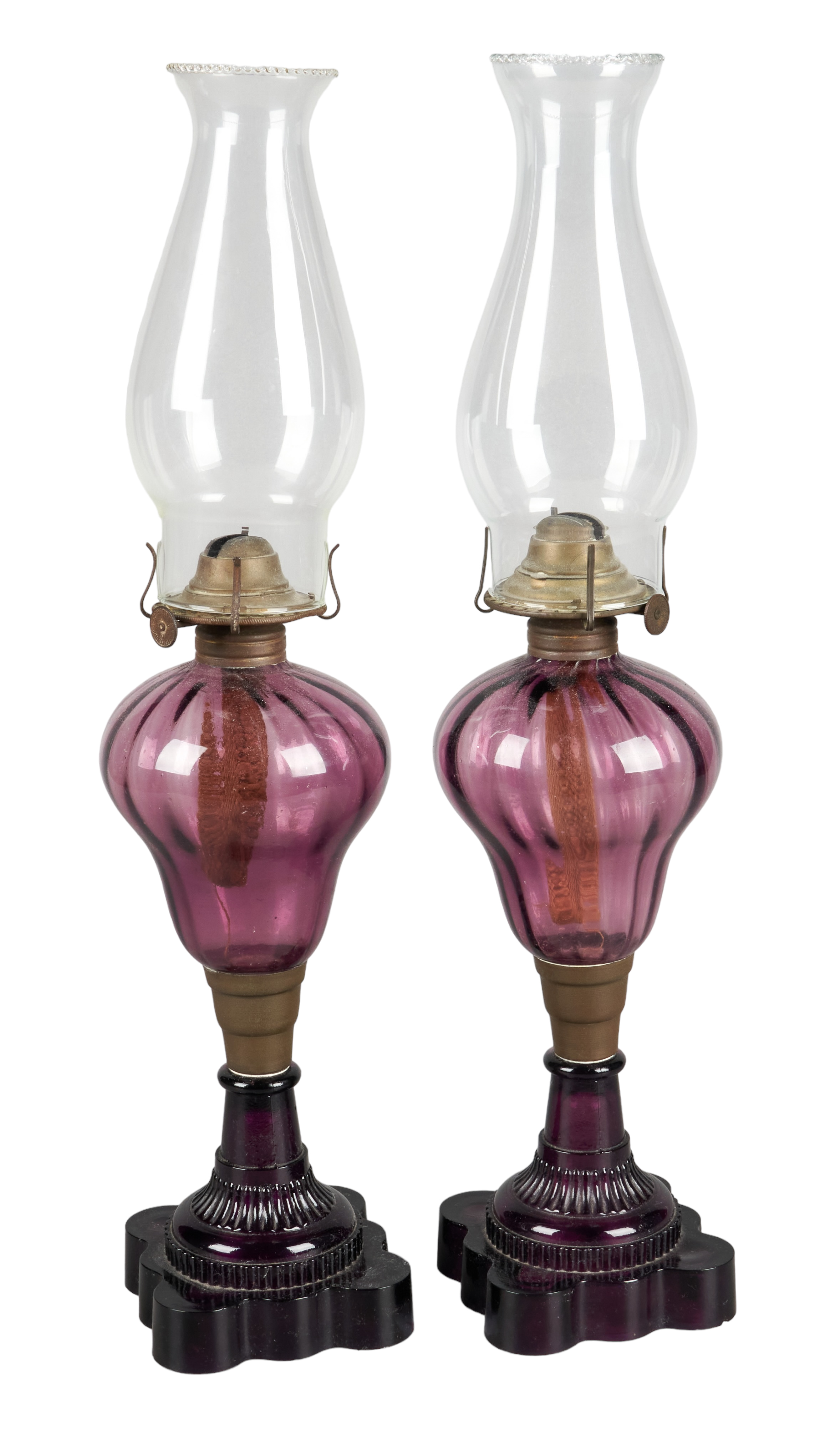 Pair of amethyst glass oil lamps,