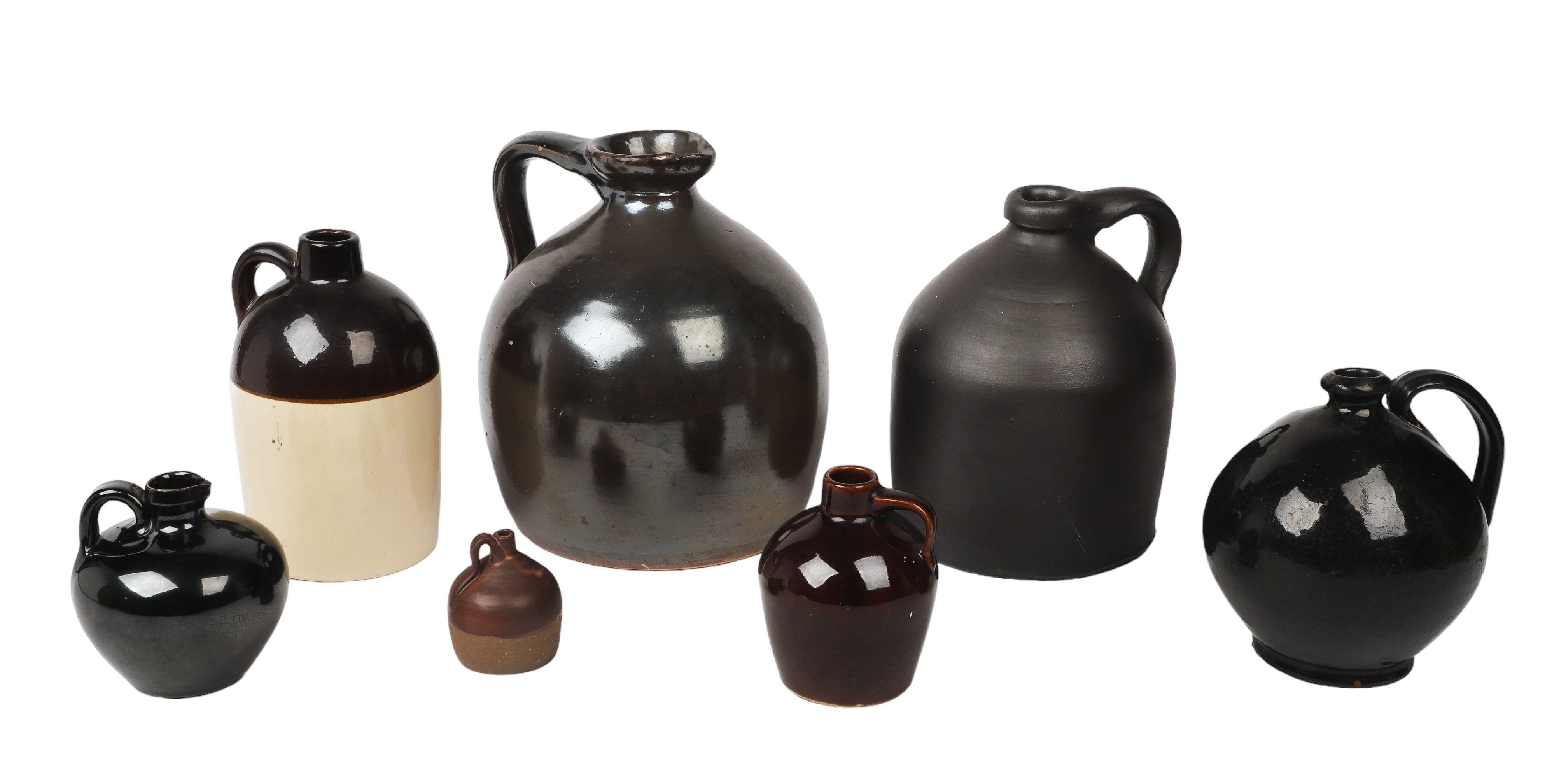 (7) Stoneware jugs to include a