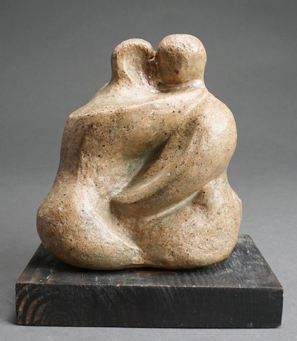 COUPLE EMBRACING CARVED STONE SCULPTURE,