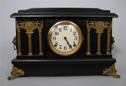 Mantle Clock    Of ebonized wood with