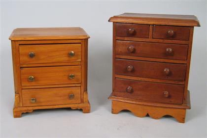 Two miniature chests of drawers