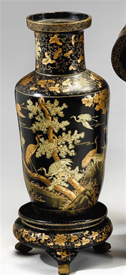 Pair of Chinese lacquered vases on stands